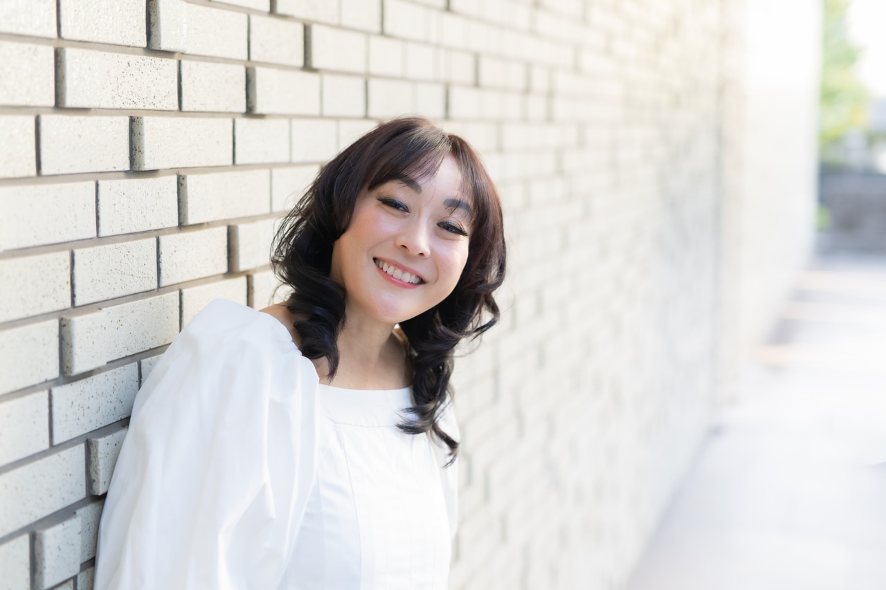 上田実絵子さん。パートナーの通訳で医師とのやり取りを行っていた。