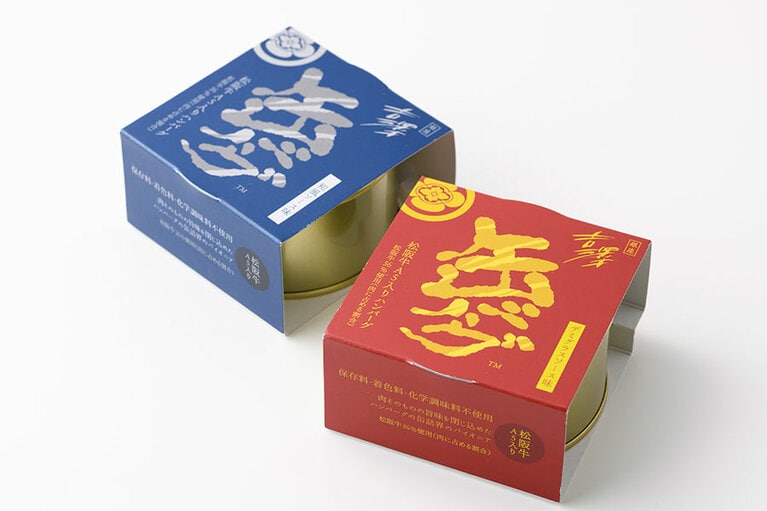 缶バーグ 各900円(160g)。左から：和風ソース味、デミグラスソース味／明治屋