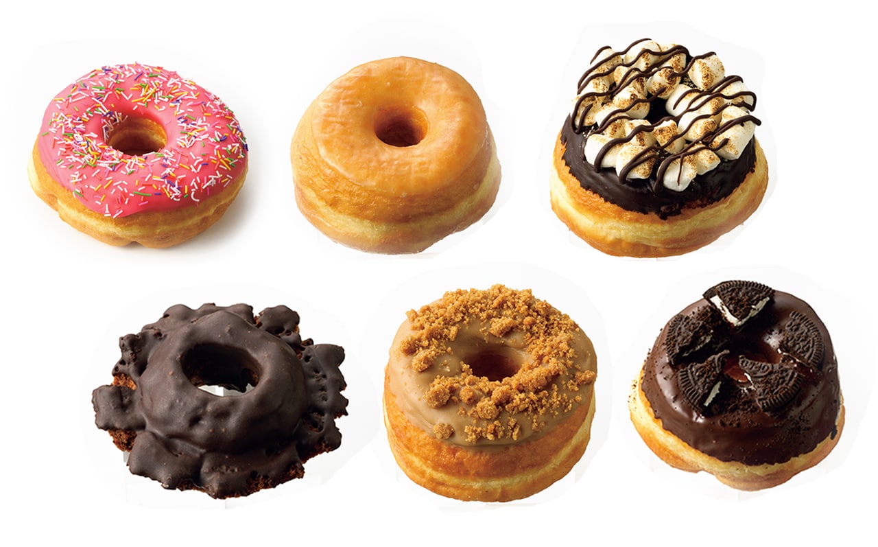 写真左から、直径約16cmのピンクスプリングルステキサス（プレミアム）580円、グレイズドレイズド 360円、スモアズレイズド 550円、チョコオールドファッション 440円、コーヒーレイズド 480円、クッキーレイズド 550円 賞味期限。12月9日オープン。