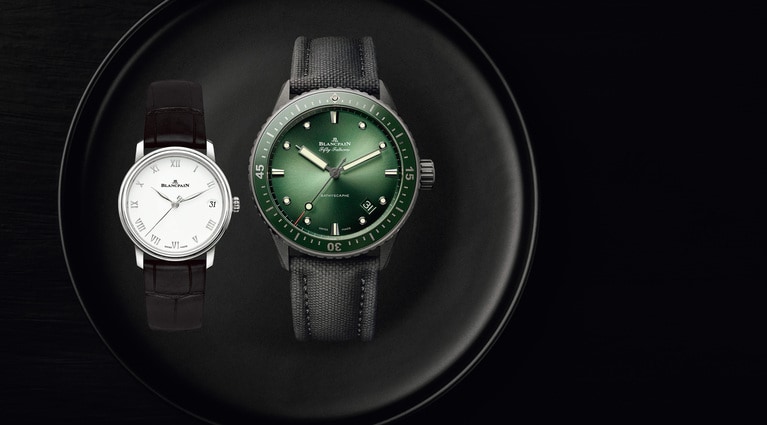 松尾さんご夫妻着用の腕時計。〈左〉克子さんの季節を伝える和装に品格を添える一本は、どんな装いにも似合う究極のタイムピース。「ヴィルレ デイト」（SS、自動巻き、アリゲーターストラップ）直径33.2mm 厚さ8.9mm 1,485,000円、〈右〉英明さんの手元には、柏屋の色でもある深緑のグリーンの文字盤が美しい時計が映える。「フィフティ ファゾムス バチスカーフ」（セラミック、自動巻き、セイルキャンバスストラップ）直径43.6mm 厚さ13.83mm 2,035,000円／ブランパン ブティック 銀座