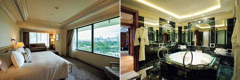 マニラの街を見渡す“ザ・ペニンシュラスイート”のベッドルーム。大理石のバスルームもエレガント。