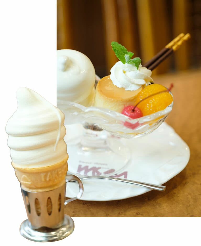 キネマ通り商店街の角地に建つ「スイートハウスわかば」は、1948年創業の名喫茶。後口さっぱりのソフトクリームをはじめ、プリン、ホットケーキ、あんみつなど、ほとんどのメニューが自家製ですこぶる美味。ソフトクリーム(写真左)はテイクアウトOK！