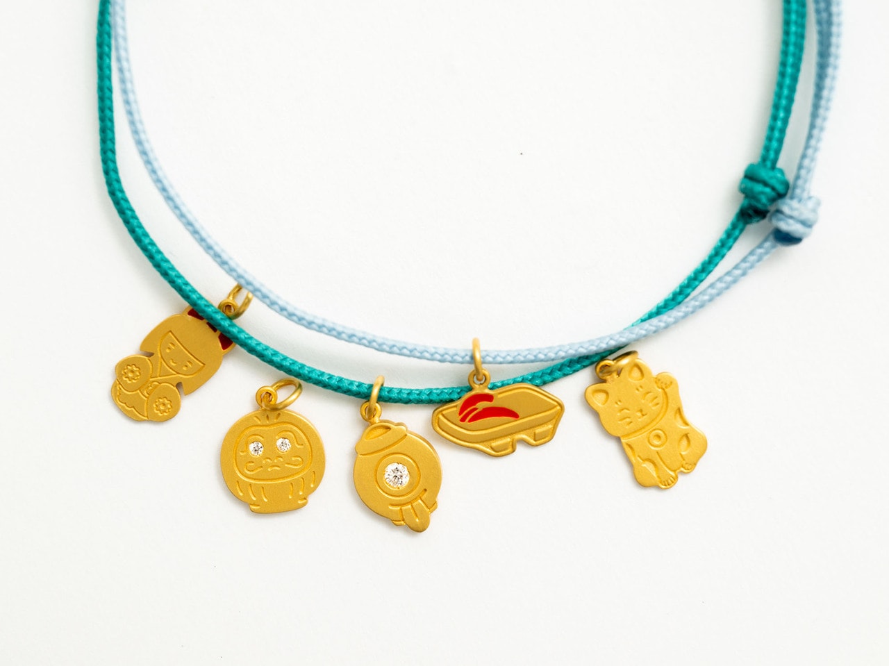 別注 Pendant with Cord Bracelet 45,100円～94,600円（22K Yellow Gold / Enamel / Diamond）