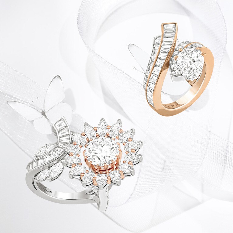 2022年に発表された大作「レジェンド オブ ダイヤモンドーホワイトダイヤモンド バリエーション」より。数種類のシェイプのダイヤモンドが見事な曲線を描きながら、壮麗な作品を作り上げている。〈下〉咲き誇る花を象った“ディアマン フルリ リング”（WG×RG×センターDIA3.02ct（DFL）） 参考商品　〈右〉リボンが優美な曲線を描く“プレシャス リボン リング”（WG×RG×センターDIA 2.07ct（DIF）） 参考商品。