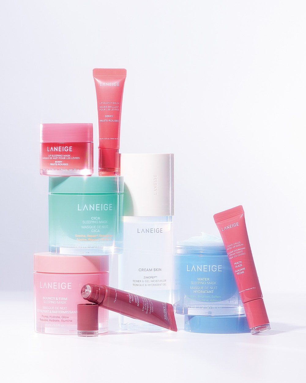 上中央から反時計回りに：ひと塗りで“ベイビーリップ”を演出する、日中用の色つきリップケア。リップグロウィバーム ベリー10g 1,870円、大人気の夜用リップケア。リップスリーピングマスク ベリー 20g 2,365円、乾燥が気になる肌を包み込むようにケア。シカスリーピングマスク N 60mL 3,850円、肌にハリとツヤを与える。バウンシースリーピングマスク 60mL 3,960円、“ドーナツリップ”で話題を呼んでいるティントリップセラム。ドーナツのグレイズのような光沢感。一番人気のモカムースカラー。グレイズ ティントリップセラム シナモンシュガー 12g 2,200円、化粧水の軽さと、ジェルクリームのようにみずみずしい保湿力を両立。ジェルクリームスキンローション 170mL 3,630円、寝不足の肌に、＋4時間眠ったような潤いケアを。ウォータースリーピングマスク N 70mL 3,740円、誰にでも使いやすい粘膜カラー。グレイズ ティントリップセラム ピーチグレイズ 12g 2,200円／すべてラネージュ