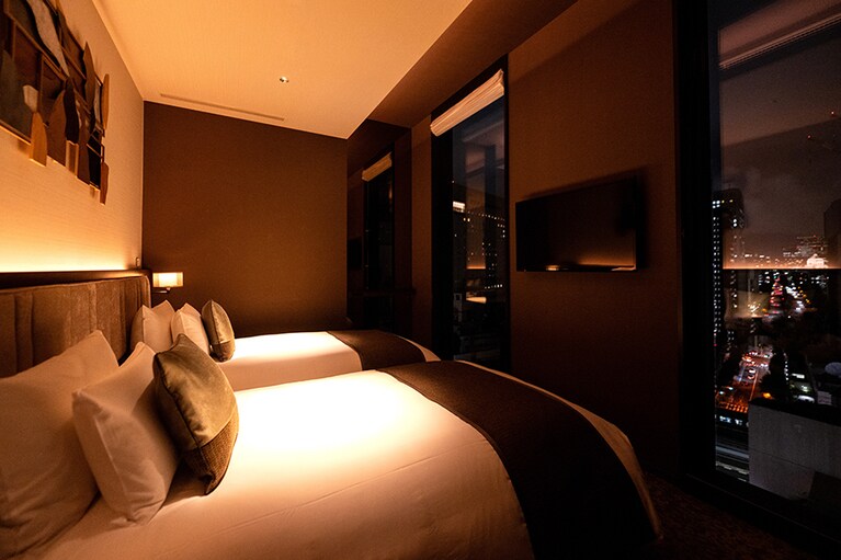 ゲストを上質な眠りへといざなう「エグゼクティブツイン」のベッドルーム。