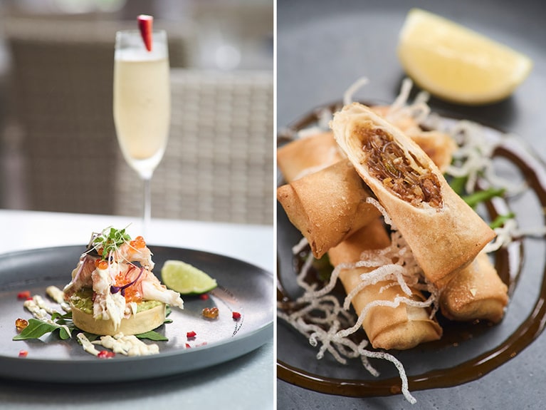 左：“バグ（ウチワエビの一種）とアボカドのタルト”$35、スパークリングワインはグラス $10～。右：“ワニの春巻き”。ワニ挽き肉と春雨、細切り野菜入り。3本 $22。