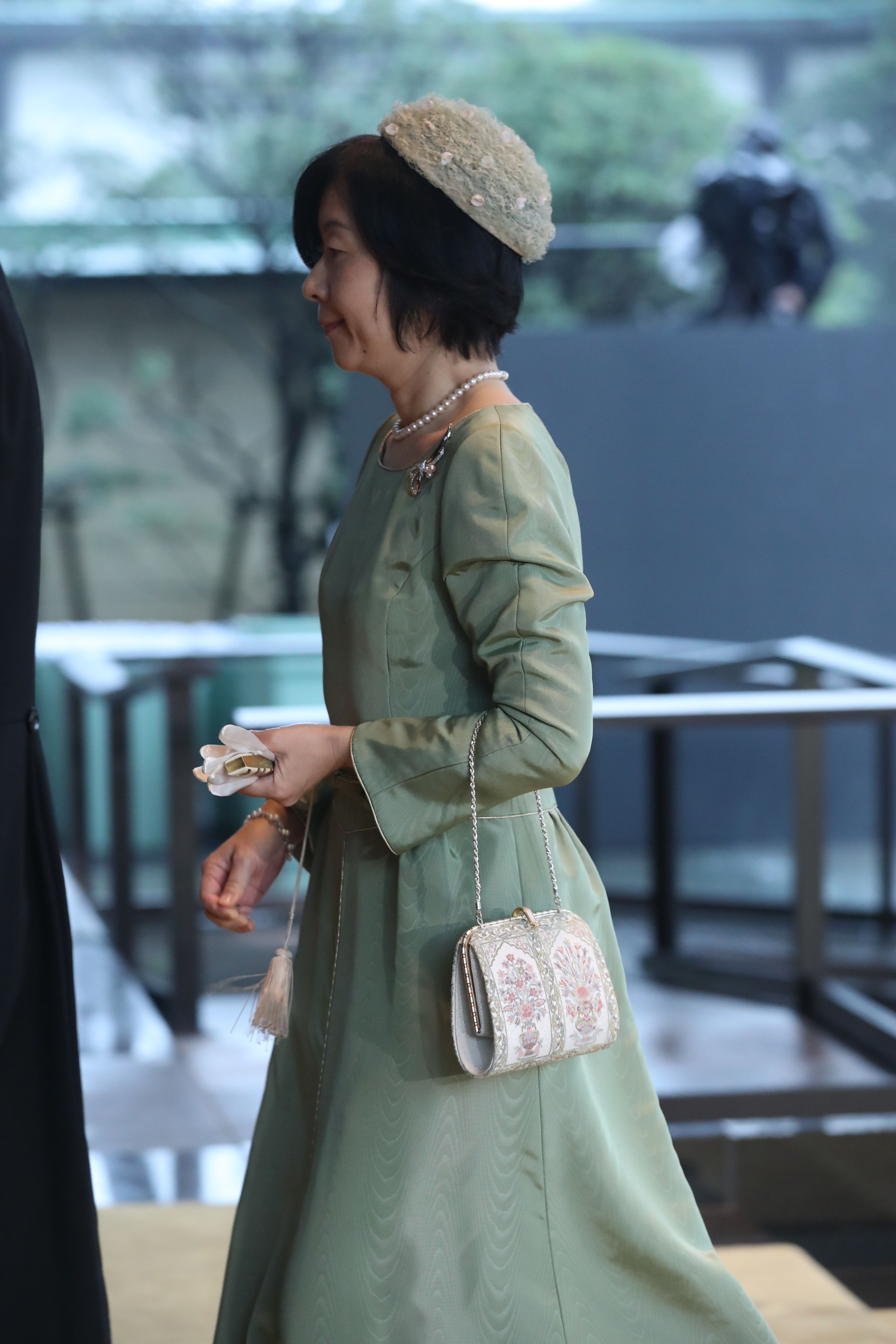 「饗宴の儀」に参列した黒田清子さん。淡いグリーンのロングドレス姿で　©JMPA