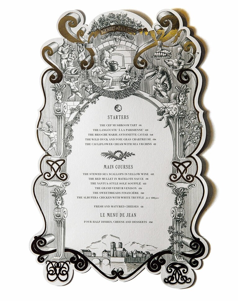オリジナルデザインのメニュー。料理人たちがイラストで描かれていて、その中にはジャン・アンベールシェフの姿も。