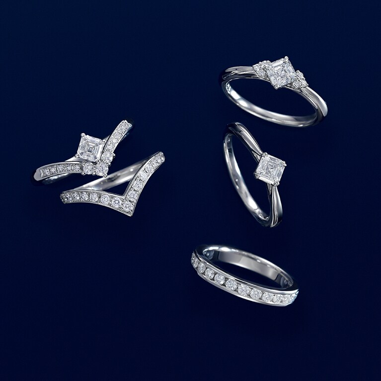1902年に開発されて一世を風靡した、58面の革新的なスクエアカット“アッシャー・カット”の進化形“ロイヤル・アッシャー・カット”。ステップカットが放つシャープで精緻な光と透明感が魅力であり、個性的なフォルムも花嫁の薬指を印象的に飾ってくれる。ブリリアントカットのエタニティとの相性も抜群。
エンゲージリング〈右上〉(PT×センターDIA0.3ct～) 546,700円～、〈右中〉(PT×センターDIA0.3ct～) 436,700円～、〈左上〉(PT×センターDIA0.3ct～) 722,700円～、エタニティリング〈右下〉(PT×DIA) 649,000円、マリッジリング〈左下〉(PT×DIA) 330,000円／すべてロイヤル・アッシャー