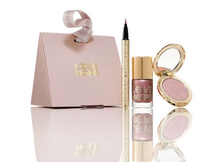 ホリデー メイクアップ  コフレ 2022 限定2種 02 左から：SNIDEL スパークル ライナー EX02 0.4mL、同 グロッシー ポリッシュ EX06 9mL、同 グロウ ヴェール EX02 3.8g 6,930円(すべて数量限定発売中)。