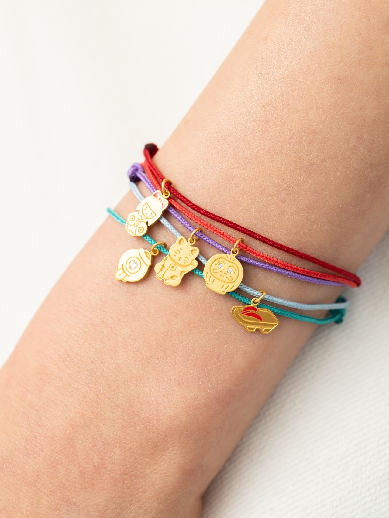 別注 Pendant with Cord Bracelet 45,100円～94,600円（22K Yellow Gold / Enamel / Diamond）